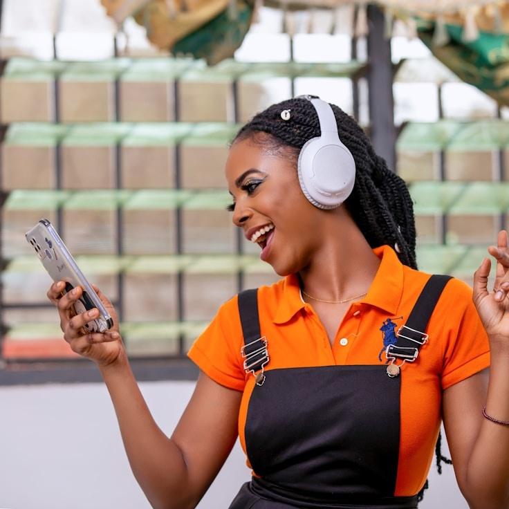 Ava Chen, Lead Design Curator at SpruceLairSpindle, reviewing corporate floral arrangements